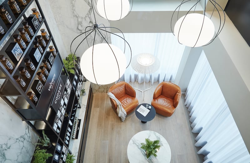 The lift opened to reveal a mellow, spacious Nordic bathhouse feel, warm wood and clean, contemporary cosiness