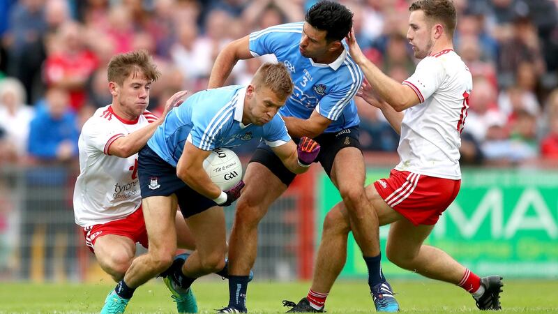 Tyrone’s Mark Bradley and Niall Sludden tangle with Jonny Cooper and Cian O’Sullivan of Dublin during the Super 8s clash in Omagh. Photograph: James Crombie/Inpho