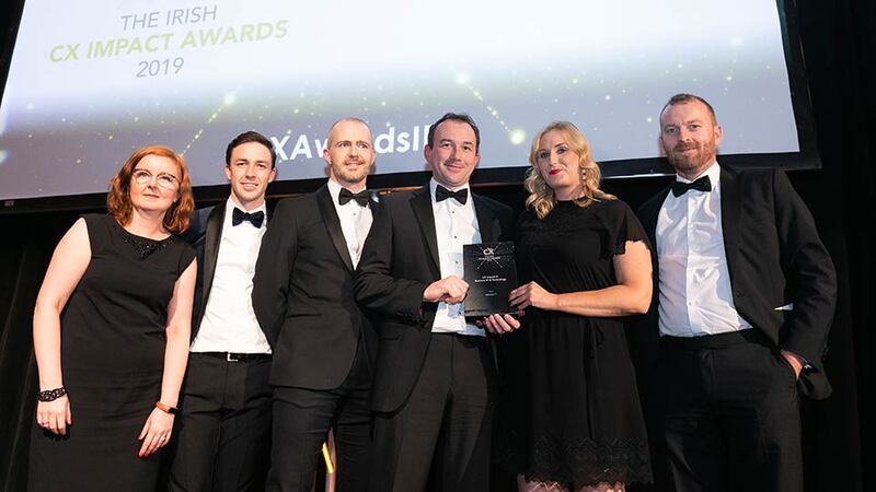 Siobhan Mallen, The CX Company presents the CX Impact in Business IT & Technology award to the Version 1 team.