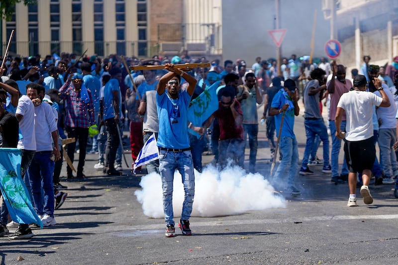 Anti Eritrean government protesters in sky-blue shirts. Photograph: Ohad Zwigenberg/AP