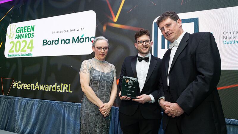 Rachel Jackson, continuous improvement lead, Codex Office Solutions and Minister Eamon Ryan, presents the green collaboration award to Ian Pyburn, IES