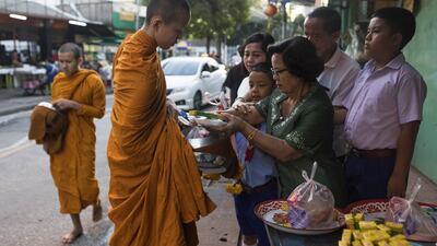 Monks collect food donations.