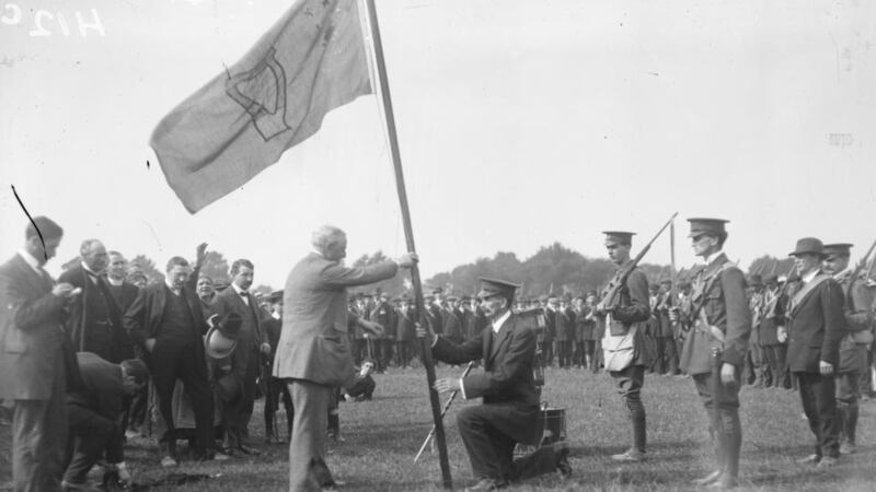 John Redmond presents a flag to the Irish Volunteers. And recruitments posters for the British Army. Courtesy, National Library of Ireland