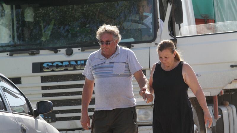 Horacio Sala, Emiliano Sala’s father, holds hands with his partner Liliana Ponce outside their home in Progreso, Argentina. Photo: Mauricio Garin/AP Photo
