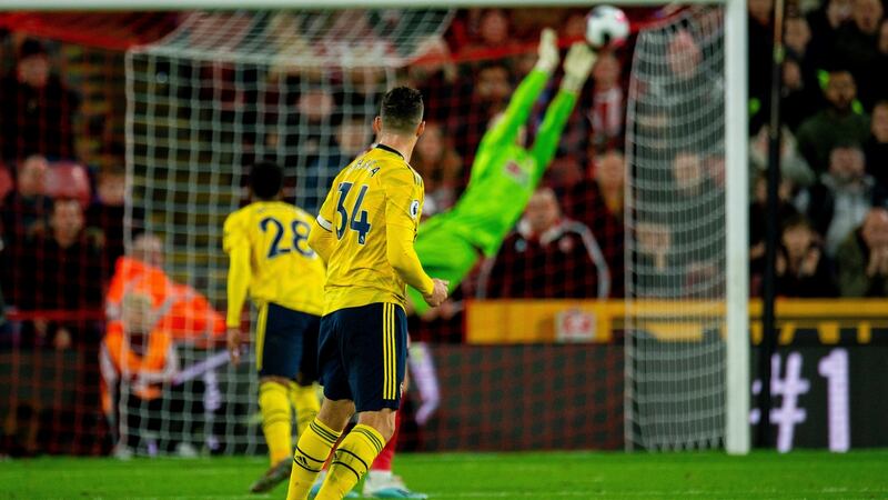 Dean Henderson saves a shot from Granit Xhaka. Photo: Peter Powell/EPA