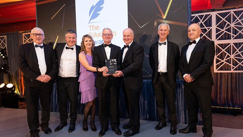 Dr Ciarán Ó Hannracháin, awards judge, presents the best international collaboration project award to the MTU & European Alliance team