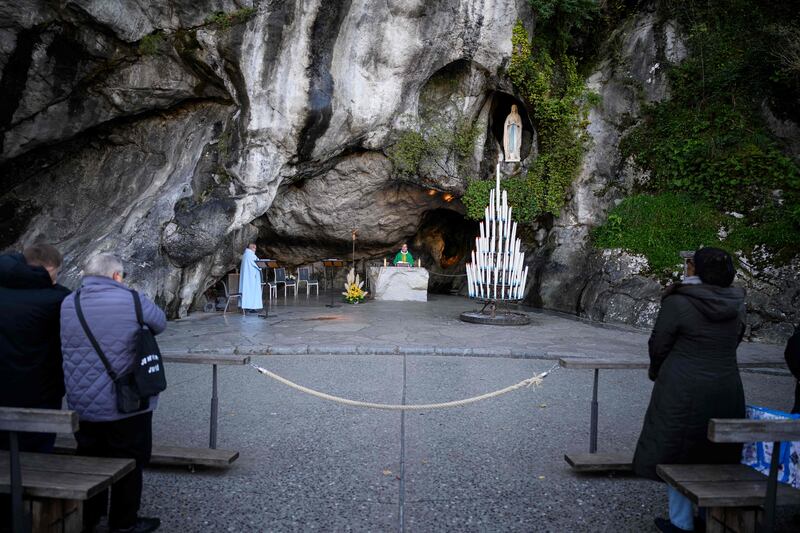 Mass at the Grotto of Massabielle at the Sanctuary of Our Lady of Lourdes. Photograph:  Lionel Bonaventure/AFP/Getty
