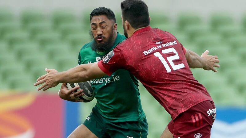 Munster’s Damian de Allende tackles Bundee Aki. Photograph: James Crombie/Inpho