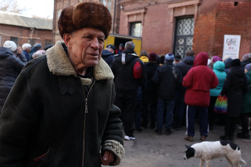 Local residents wait to receive food kits distributed by volunteers from the  Responsible Citizens NGO in Sloviansk. Photograph: Anatolii Stepanov/AFP via Getty Images