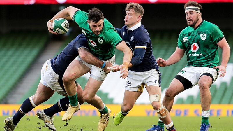 Ireland’s Robbie Henshaw is tackled by Fraser Brown and Dy Graham of Scotland. Photograph: Laszlo Geczo/Inpho