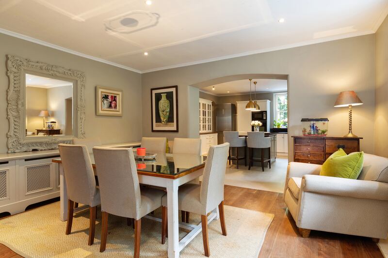 A sunroom with more beautiful joinery, built-in seats and panelled walls leads from the breakfastroom (above) to the garden.