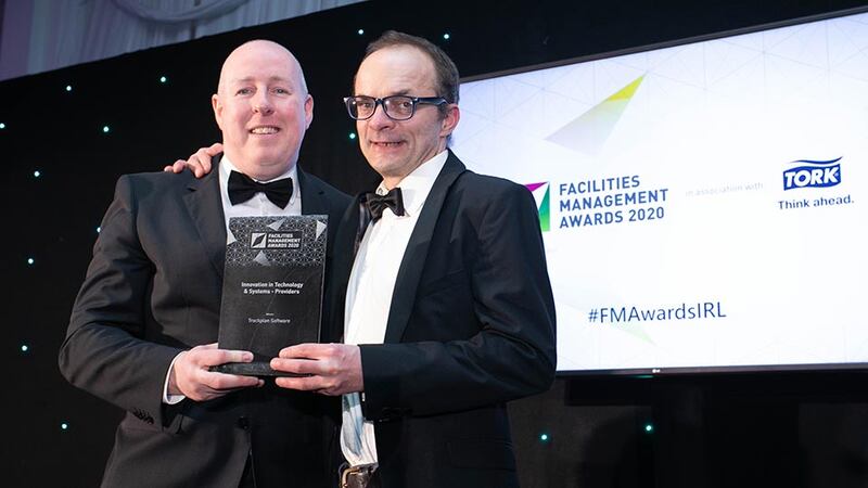 Les Sheridan, Managing Director, Mitie Facilities Management presents the Innovation in Technology & Systems - Providers award to Mark Cochrane, Trackplan Software
