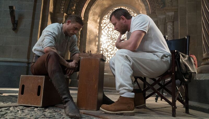 Charlie Hunnam and Guy Richie playing chess on the set of King Arthur: Legend of the Sword