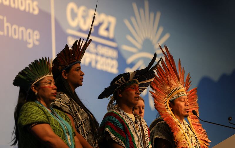 President of the Federation of the Huni Kui People in Acre in Brazil leading some of his fellow delegates in prayer. Photograph: Fayez Nureldine/AFP/Getty