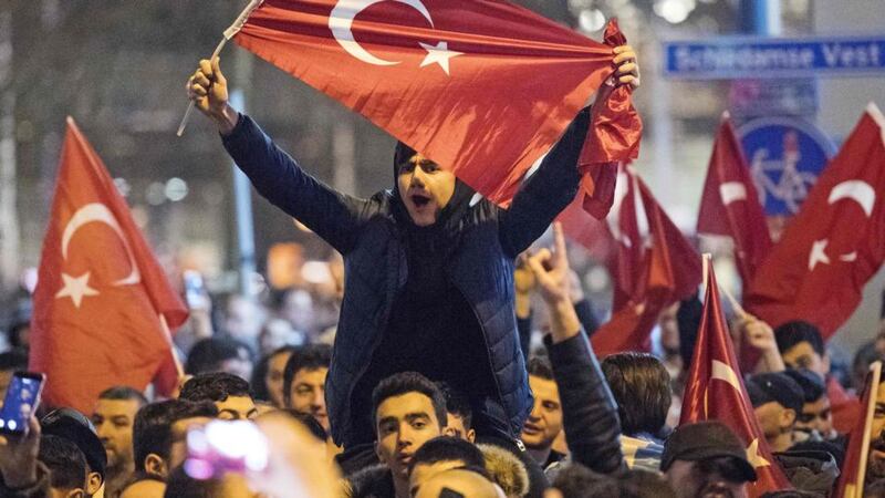 Protesters demonstrate near the Turkish consulate in Rotterdam on Sunday  after the Turkish family minister was removed from the country.  Photograph:  Marten van Dijl//AFP/Getty Images