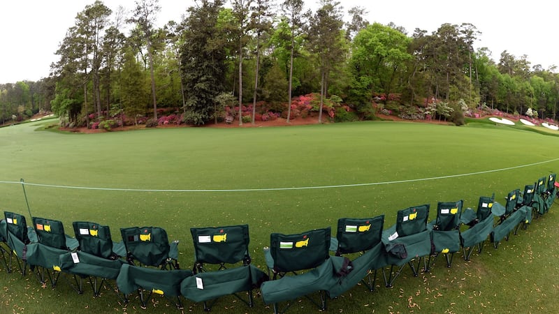 Patrons line up chairs on Amen Corner. Photograph:  Don Emmert/AFP/Getty Images