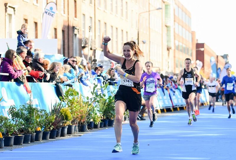 Aideen O'Connor from Dublin crosses the finish-line during the 2019 Dublin Marathon. Photograph: Sam Barnes/Sportsfile