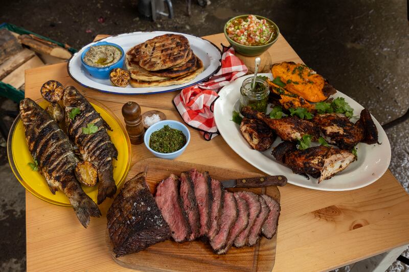 Dishes by Andy Noonan: Chimichurri; salsa criolla; flatbreads; baba ganoush; jerk sea bass; reverse seared picanha; and spatchcock barbecue chicken. Photograph: Tom Honan