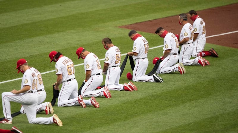 Members of the Washington Nationals kneel in support of the Black Lives Matter movement. Photograph: AP