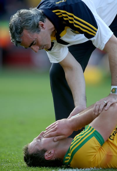 Donegal manager Jim McGuinness consoles his captain Michael Murphy after the 2014 All-Ireland football final. Photograph: Donall Farmer/Inpho