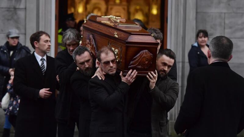 The Cranberries: Fergal Lawler (centre), Noel Hogan (second left) and Mike Hogan (right) help carry Dolores O’Riordan’s coffin on January 21st, 2018. Photograph: Charles McQuillan/Getty