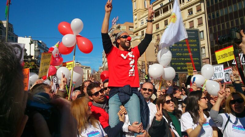 A&E doctor Jesús Candel is carried by supporters during a protest in Granada against restructuring the city’s healthcare. Photograph: Guy Hedgecoe