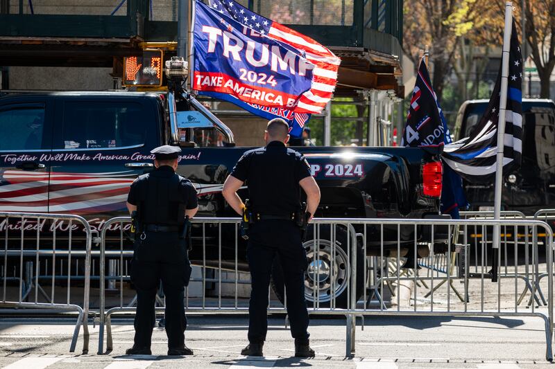 As police watch, supporters of Donald Trump gather outside Manhattan Criminal Courthouse, New York City, for the start of the first-ever criminal trial against a former president of the United States, on April 15th, 2024. Donald Trump faces 34 felony counts of falsifying business records. Photograph: Spencer Platt/Getty