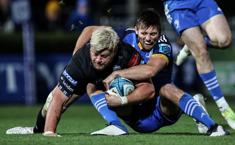 Glasgow Warriors' Oli Kebble is tackled by Leinster's Ross Byrne during the URC clash at the RDS. Photograph: Billy Stickland/Inpho 