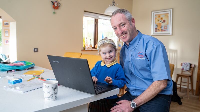 Hynes’ youngest, Lauren, helps her dad check out the status of his investments online