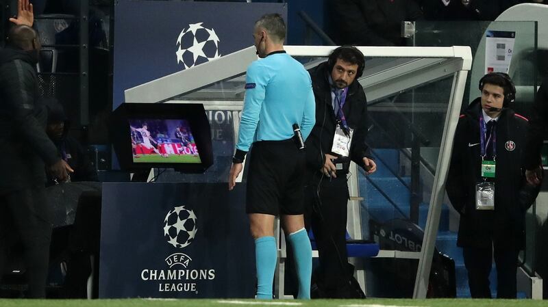 Match referee Damir Skomina studies the VAR System prior to awarding Manchester United a penalty during the  Champions League match at the Parc des Princes. Photograph:  John Walton/PA Wire
