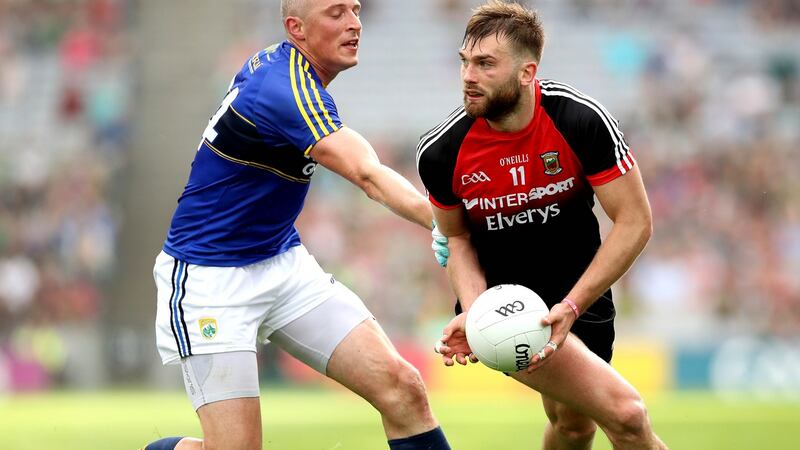 Mayo’s Aidan O’Shea in action against and Kieran Donaghy of Kerry during the All-Ireland semi-final replay. Photograph: Ryan Byrne/Inpho