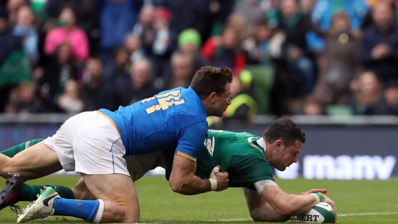 Ireland’s Robbie Henshaw scores a try during the NatWest Six Nations match at the Aviva Stadium, Dublin, in February, with Italy’s Tommaso Benvenuti on his back. Photograph: Brian Lawless/PA Wire