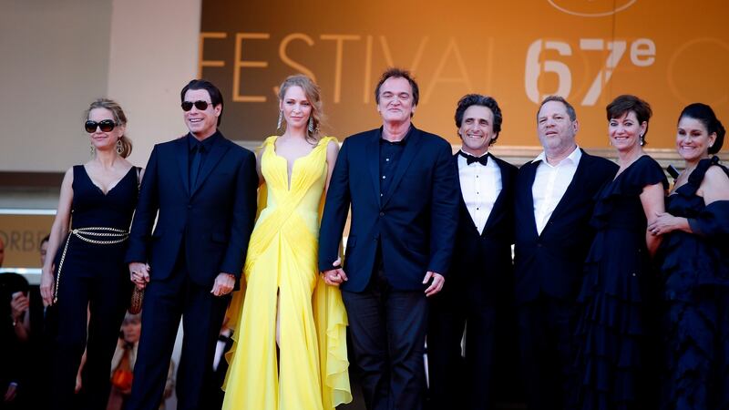 US actor Uma Thurman (yellow dress), US director Quentin Tarantino (centre, in front)  and US producer Harvey Weinstein (third right)  arrive for a screening of the film Sils Maria at the 67th  Cannes Film Festival in Cannes,  France, in 2014.  Thurman is perhaps best known for her roles in  Pulp Fiction and  the Kill Bill films, directed by Tarantino and produced by Weinstein. File photograph: Valery Hache/AFP/Getty Images