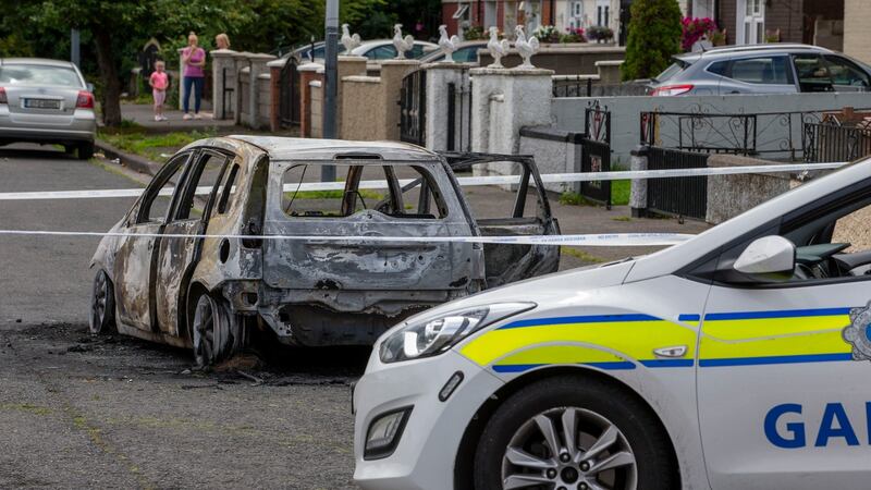A burnt out car on Le Fanu Drive, Ballyfermot Dublin. Photograph: Tom Honan