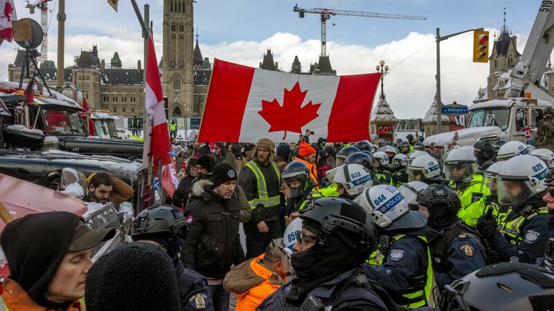 Police face off with demonstrators participating in a protest organised by truck drivers opposing vaccine mandates on Wellington Street on Saturday in Ottawa, Ontario. Photograph: Alex Kent/Getty Images