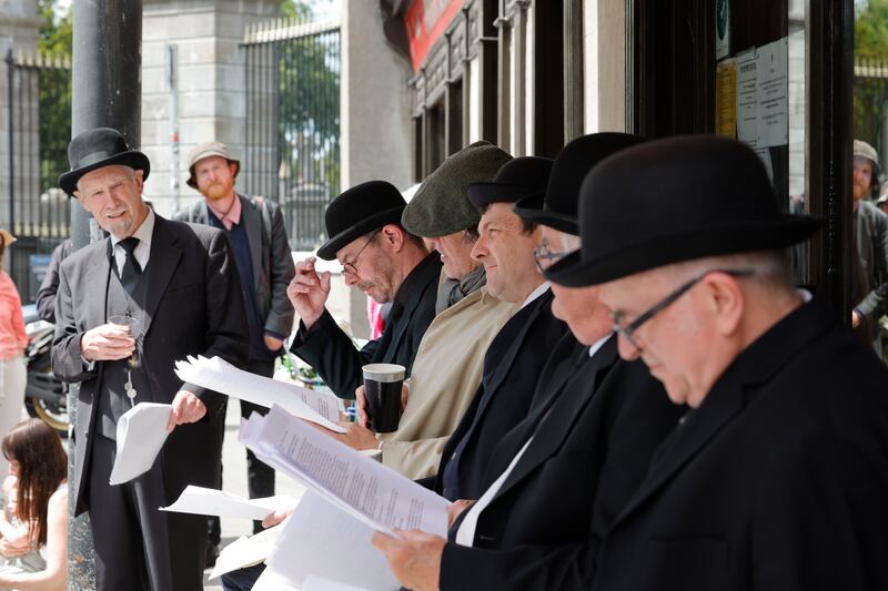 Members of the Joycestages perform ‘In Barney Kiernan's Pub’ for the Cyclops episode of Ulysses at Kavanagh's Gravediggers pub in Glasnevin. Photograph: Alan Betson 
