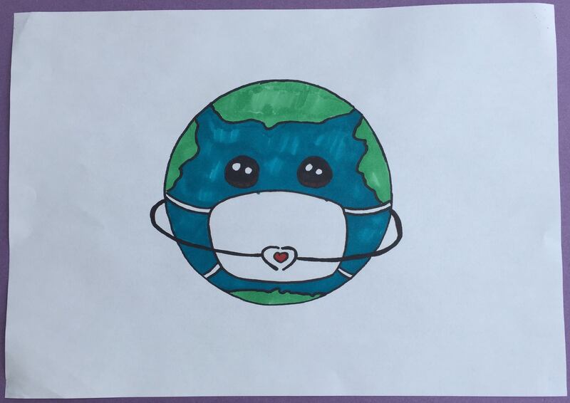 Eva Boo, aged 12.
'My picture shows the world wearing a mask. It symbolises the whole world working together to protect against Covid- 19. The Earth is holding its hands in a heart because even though we can't see people we love right now we are keeping our distance to protect them because we love them.'