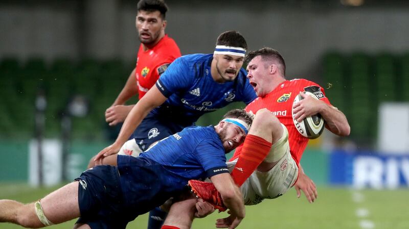 Leinster’s Caelan Doris tackles Peter O’Mahony of Munster during the game at the Aviva Stadium. Photograph: Bryan Keane/Inpho
