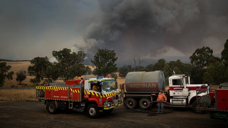 A firefighting tanker prepares to take on water near Maragle,  on Friday. Photograph: Matthew Abbott/The New York Times