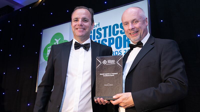 Martin Kelly, Senior Relationship Manager at AIB Corporate Banking, presents the Overall Logistics & Transport Excellence Award to Brian Beattie, McCulla Ireland. 