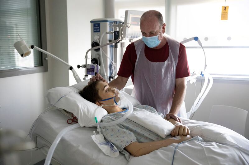 Alan O’Connor watches over his son, Glyn, in the Mater’s ICU. Photograph: Chris Maddaloni