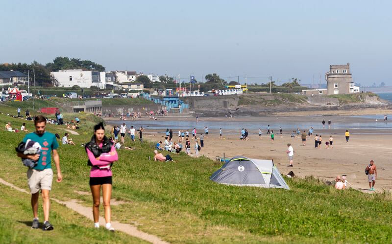 Crowds throng around and on to Portmarnock Beach, Dublin. Photograph: Colin Keegan/Collins 