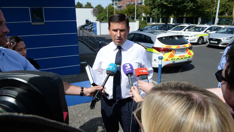 Supt Ian Lacken speaking to reporters about the death of a man in Tallaght today at Butler Park. Photograph: Cyril Byrne/The Irish Times