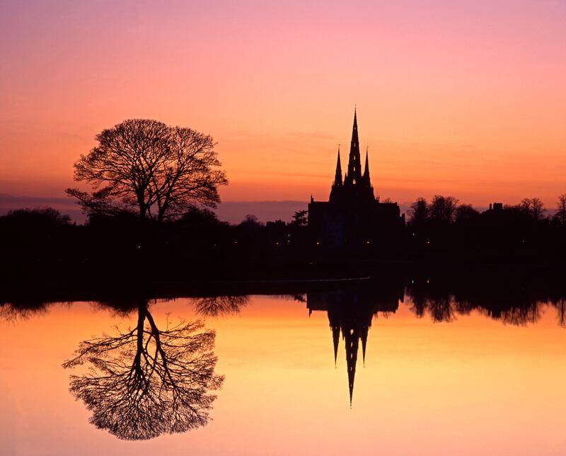 Cathedral reflected in Stowe Pool at sunset in Lichfield