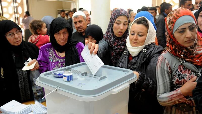 Syrians cast their votes in Syria’s presidential elections at a polling station in Jdaydet Yabous yesterday. Photograph: EPA/Sana