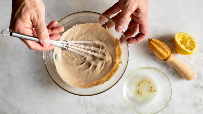 A simple sauce of tahini, garlic and lemon finishes the dish. Photograph: Andrew Scrivani/The New York Times