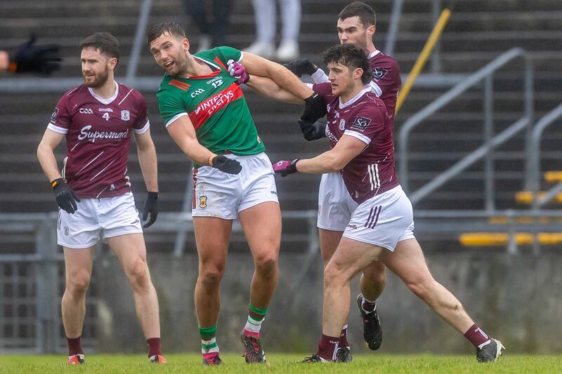 Galway’s Kieran Molloy getting to grips with Aidan O'Shea of Mayo. Photograph: Morgan Treacy/Inpho