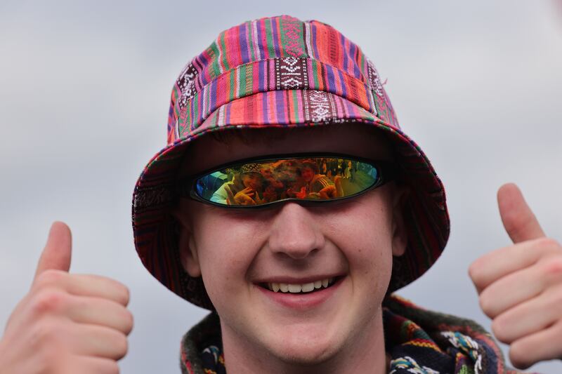 Electric Picnic 2025: Ross Gormley at the Stradbally festival, with friends Sam Hayes, Noah Walsh and Oisín Marry reflected in his glasses. Photograph: Alan Betson