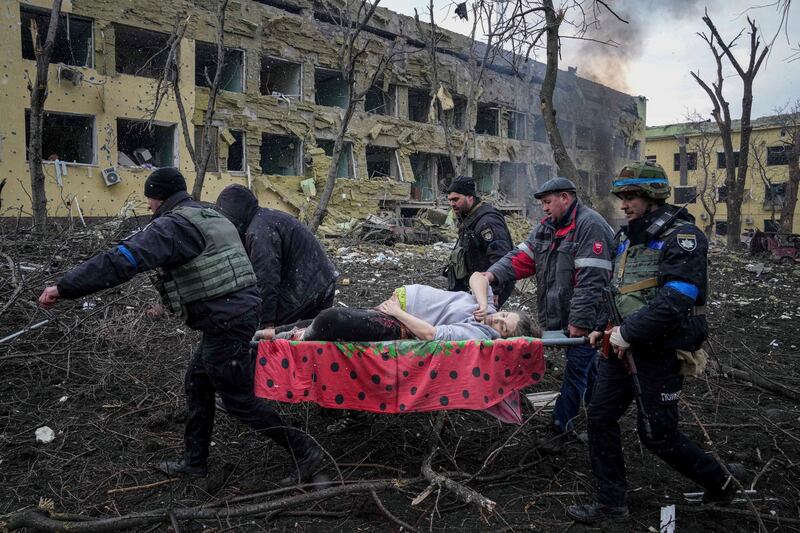 People in Mariupol, Ukraine, carry a pregnant woman who was injured when Russia bombed a maternity hospital on March 9th, 2022. The woman and her baby subsequently died. Photograph: Evgeniy Maloletka/AP