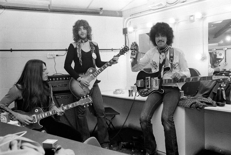 Thin Lizzy: Phil Lynott with guitarists Scott Gorham and Brian Robertson, backstage in London in 1974. Photograph: Michael Putland/Getty